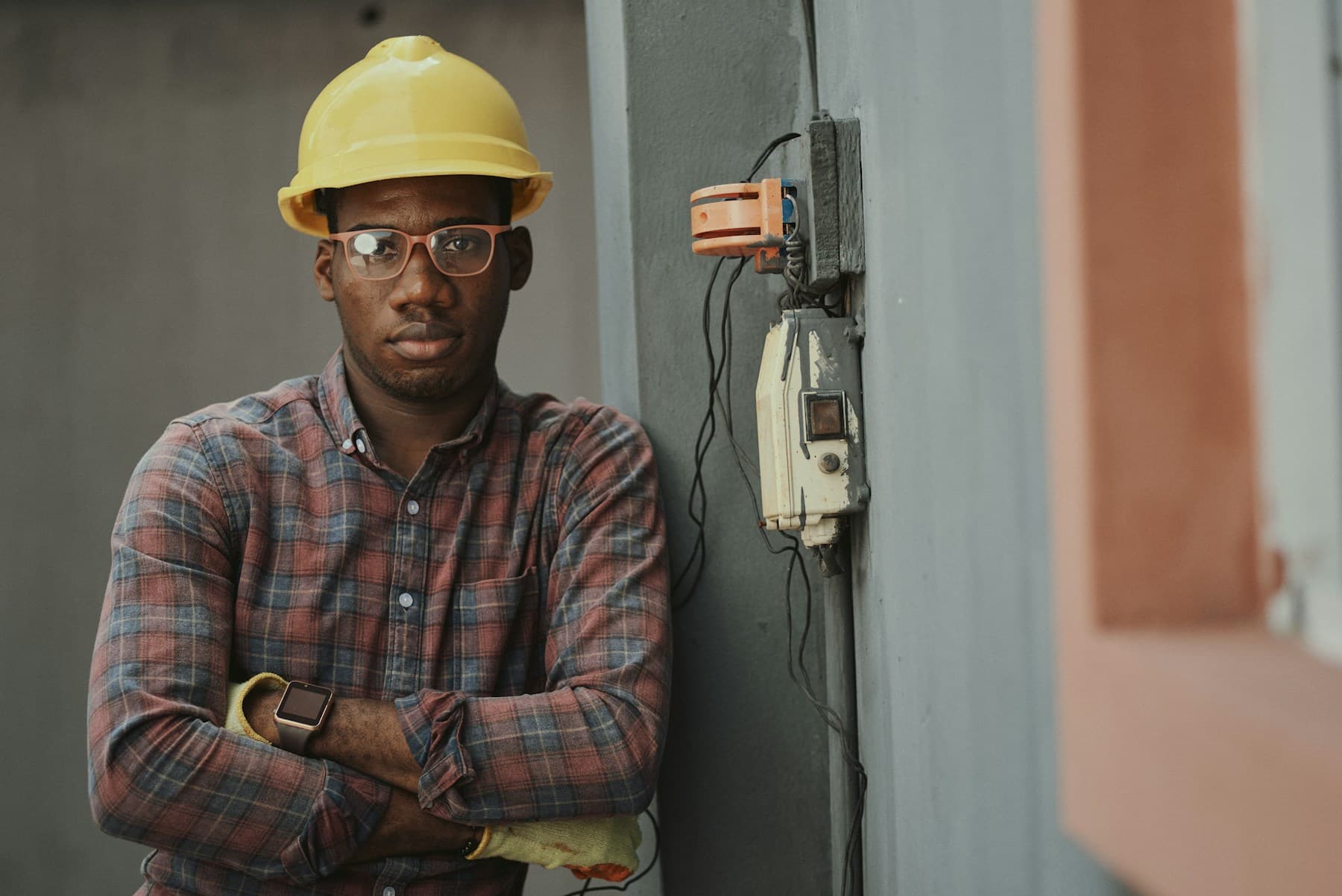 Technician reviewing electrical work on site