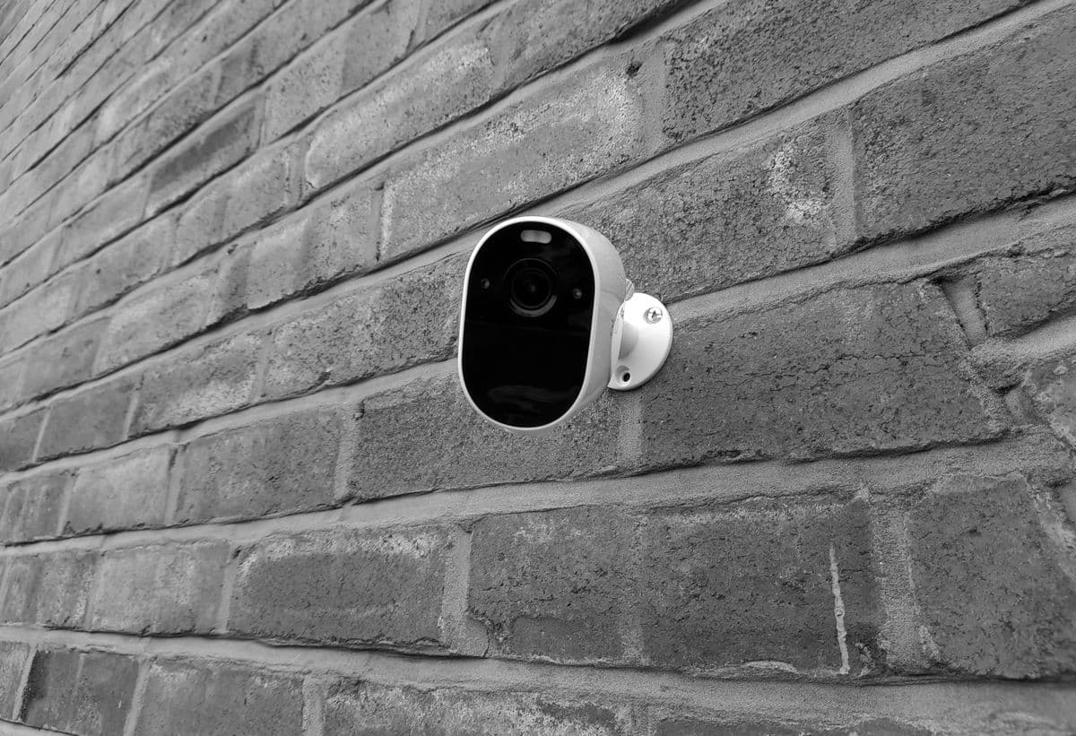 Security camera mounted on a brick wall